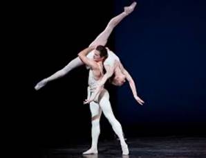 ballet dancers with black backdrop